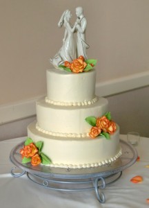 wedding cake orange yellow  roses simple flowers